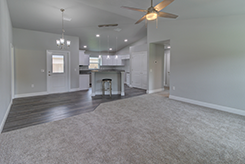 Great Room Facing Back Door and Kitchen